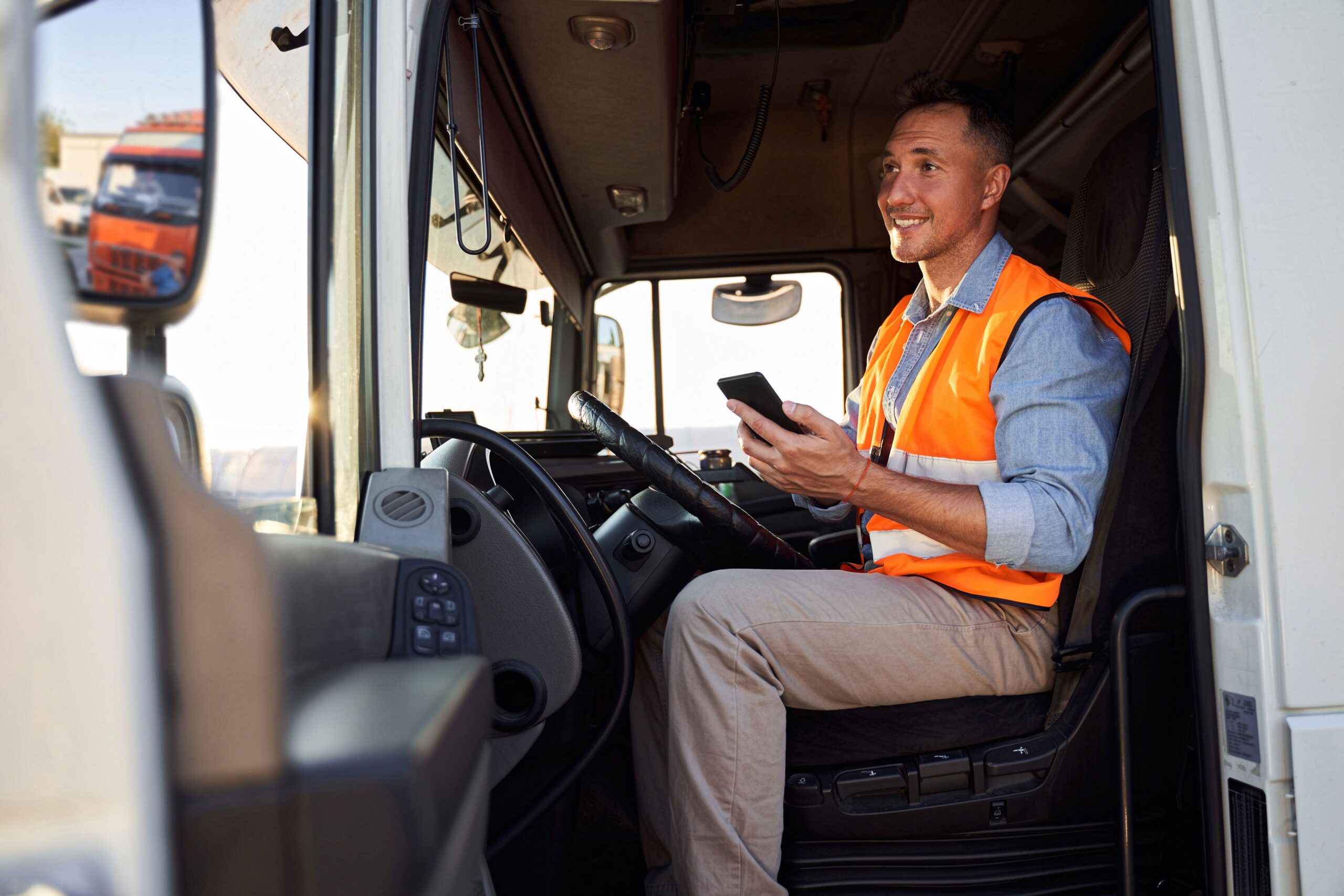 man in truck using remote support on his phone